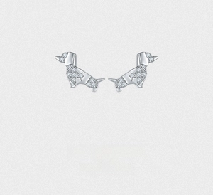 Close-up of S925 silver dachshund stud earrings with sparkling zircon star inlay