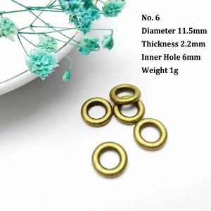 Detailed macro view of 11.5mm bronze hammered texture spacer rings for DIY jewelry making