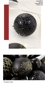 Detail of black and gold Christmas balls with swirl patterns and gold stars for trees