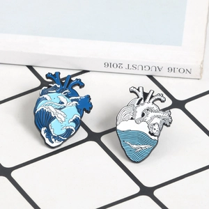 Cute heart-shaped blue wave enamel pins set featuring a whale and ocean design
