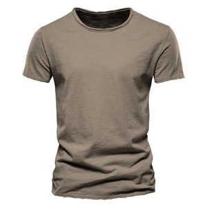 Detail shot of the textured slub cotton fabric and V-neckline of a men's t-shirt