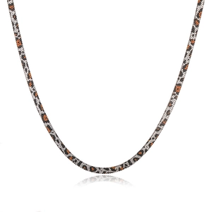 Macro detail of a 5mm leopard print stainless steel snake chain necklace with sleek texture