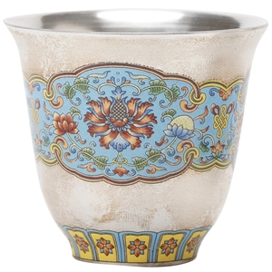 Exquisite silver-lined cloisonne tea cup with colorful enamel floral patterns on white