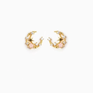 Detail of 18K gold-plated star and moon earrings with pink zircon stones and white crystals