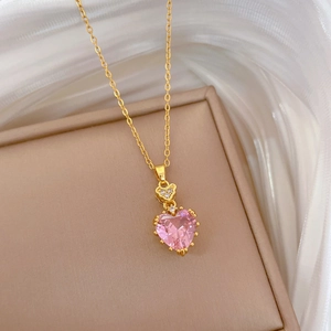 Pink heart zircon necklace in gold finish on an elegant jewelry display box