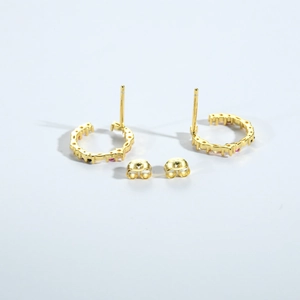 Detailed macro view of S925 sterling silver gold earrings with colorful zircon stones