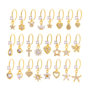 Golden earrings with assorted star and heart zircon pendants in a high-quality display