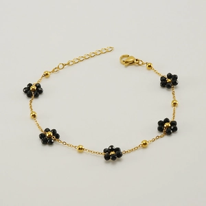 Bohemian gold stainless steel bracelet with black crystal flower charms and bead accents