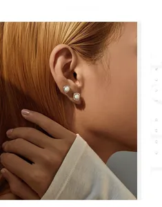 On-model view of French chic S925 silver studs with round and square opal stones