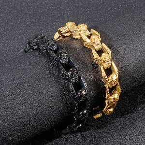 Vintage punk skull chain bracelets in gold and black steel shown from a 45-degree angle