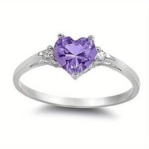 Detailed macro view of a heart-shaped purple gemstone ring with silver metal band and side diamonds