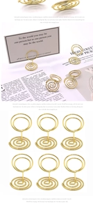 Detailed view of 6 gold spiral metal photo clips with round double-loop memo holders