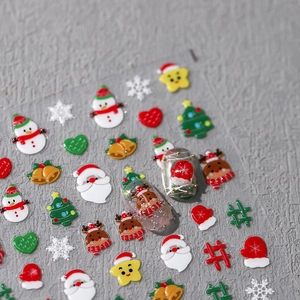 3D Christmas snowman and reindeer nail art stickers with embossed cartoon holiday patterns