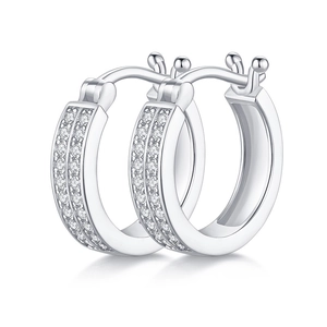 Polished silver earrings with double-row moissanite stones in a minimalist hoop design