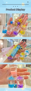 Detail of unicorn milk tea cup liquid sand keychain with Happy Moments strap and bell