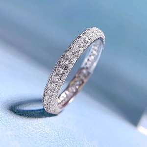 Macro view of S925 silver ring featuring full-circle pave-set cubic zirconia stones