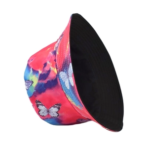Close-up of colorful tie-dye bucket hat with butterfly patterns and black inner lining