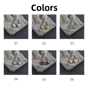 Detailed grid of 18k gold plated teardrop glass charms in six vibrant assorted colors
