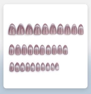 Detail of gray cat-eye almond press-on nails set with metallic magnetic shimmer finish