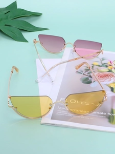 Macro shot of stylish half-frame cat eye sunglasses in yellow and pink gradient tints
