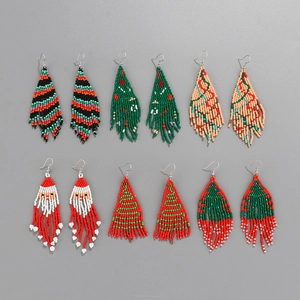 Handmade beaded tassel earrings featuring Christmas trees and Santa Claus motifs