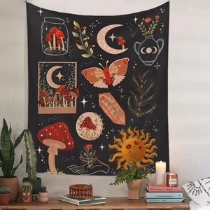 Detail of mushroom tapestry with moth and moon motifs on a white wall in a cozy boho room