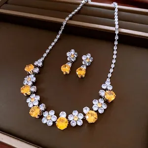 Vintage zircon flower jewelry set including necklace and drop earrings in silver and gold