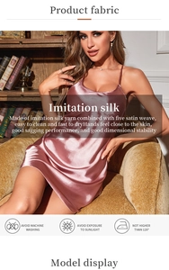 Detail showing pink satin nightgown fabric texture with care instructions and icons