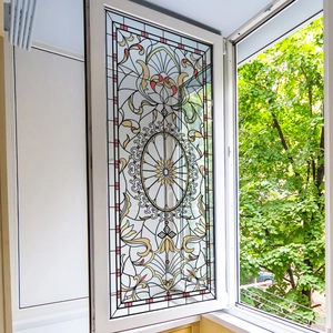 Colorful floral static cling window film with geometric stained glass patterns on glass