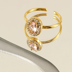 Adjustable gold plated stainless steel ring with pink oval gemstone and crystal halo