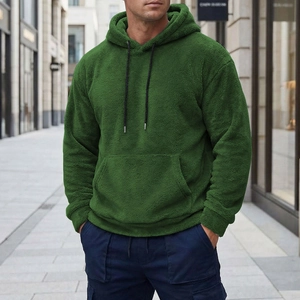 Detail of forest green sherpa fleece hoodie showing fuzzy texture and black drawstrings