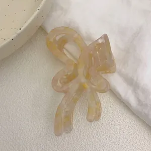 Elegant acetate butterfly hair claw clip with cream pink marble texture for thick hair