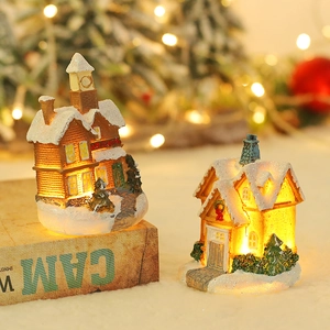 Luminous resin Christmas village houses with LED lights and festive snowy roof decor