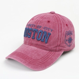 Detailed embroidery of BOSTON logo on washed magenta cotton baseball cap