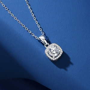 Elegant S925 sterling silver sugar cube necklace with 1.25ct moissanite pendant on blue background