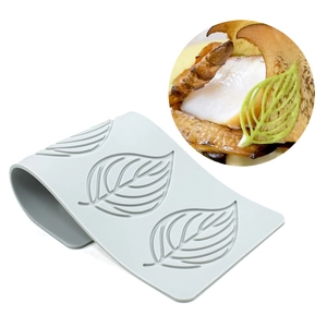 Macro detail of leaf-shaped silicone lace mat mold for molecular gastronomy garnish