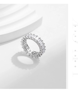 Macro view of S925 silver ring featuring baguette-cut cubic zirconia in a full eternity band