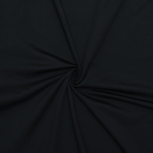 Macro shot of high-density black knit fabric showing premium texture and ribbed weave detail