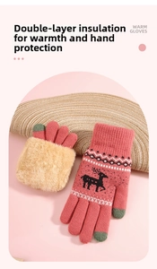 Detail of pink knitted glove showing thick faux fur lining and reindeer pattern