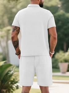 Detail of white waffle knit texture on men's summer polo and shorts set from the back view