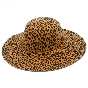 Top view of wide brim wool fedora hat with leopard print and decorative band