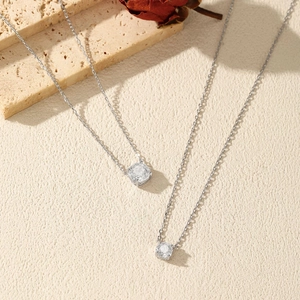 S925 sterling silver octagon rose cut diamond pendant necklaces on a stone background
