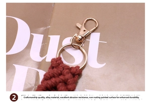 Macro detail of hand-woven cotton keychain with golden alloy lobster clasp and ring