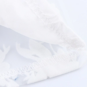 Detailed close-up of white mesh fabric with elegant overlock stitching for women's V-neck top