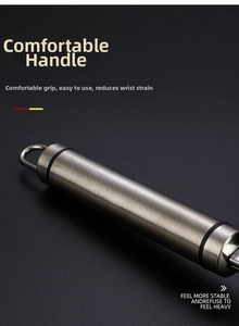 Macro detail of ergonomic stainless steel whisk handle with brushed finish and hanging loop