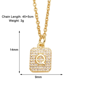 Detailed view of square gold necklace with letter Q pendant and sparkling zircon stones