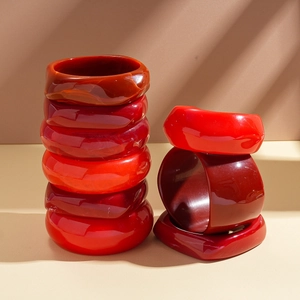 Retro red resin bangle set with geometric irregular shapes and marbled textures