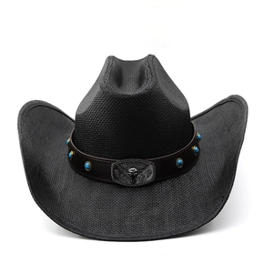 Detail of black cowboy hat with leather band, turquoise beads and bull head buckle