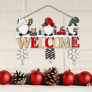 Detail of wooden Christmas gnome welcome sign with snowflake pendants and pine cones