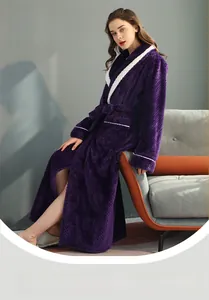 Detail of purple waffle knit bathrobe showing textured fabric and white contrast trim